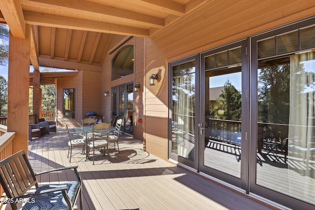 wooden deck with an outdoor living space