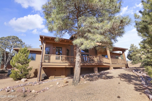 rear view of property with a deck