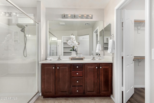 bathroom with vanity and walk in shower