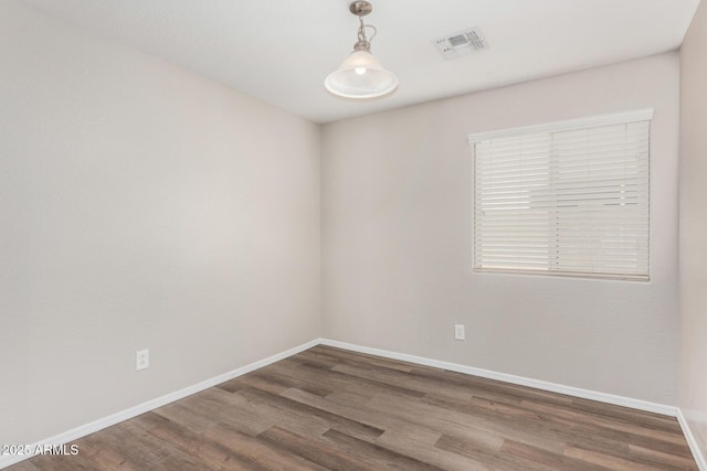 empty room with dark hardwood / wood-style floors