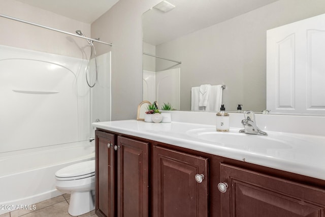 full bathroom with tile patterned floors, toilet, shower / washtub combination, and vanity