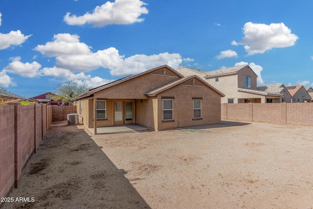 rear view of house featuring a patio and central air condition unit