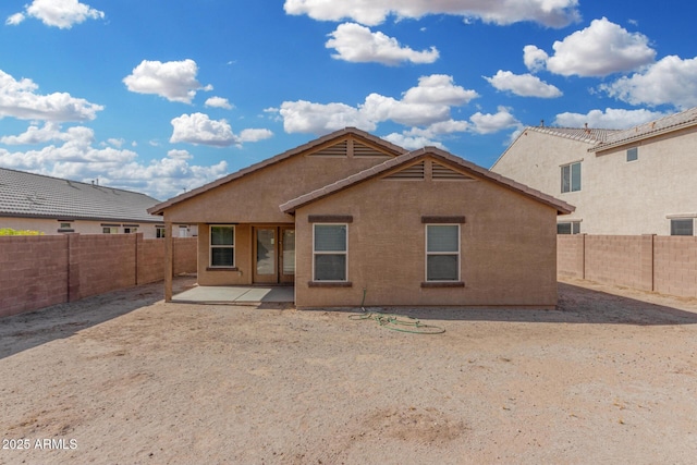 rear view of property featuring a patio area