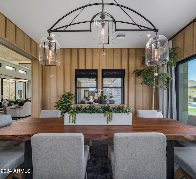 dining space with wooden walls