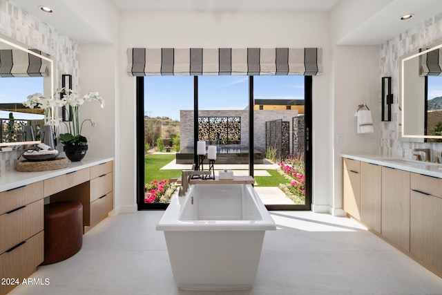 24046 N 126th Pl, Scottsdale, AZ 85255 - full bath with a freestanding tub, vanity, baseboards, and recessed lighting