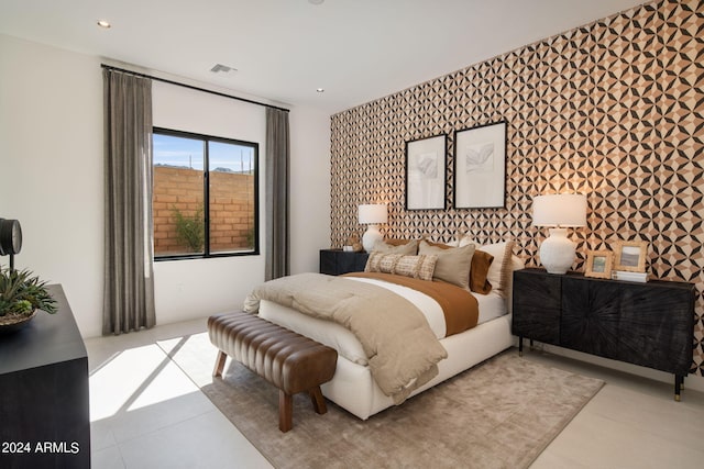 bedroom with light tile patterned floors