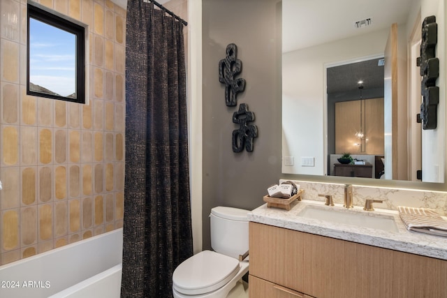 full bathroom featuring shower / tub combo with curtain, vanity, and toilet