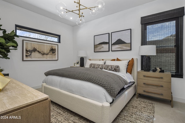 bedroom featuring an inviting chandelier