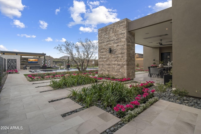 view of patio / terrace featuring ceiling fan