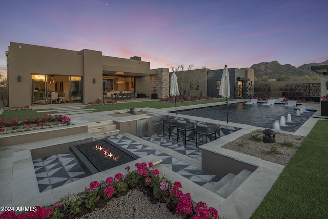 24046 N 126th Pl, Scottsdale, AZ 85255 - exterior space featuring an outdoor fire pit, a patio area, and an outdoor bar
