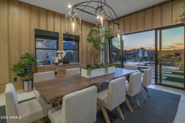 24046 N 126th Pl, Scottsdale, AZ 85255 - dining area featuring a chandelier, floor to ceiling windows, and wooden walls