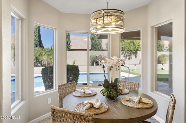 dining space with a notable chandelier