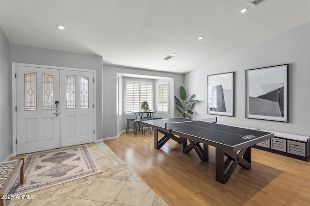 recreation room featuring light wood-type flooring