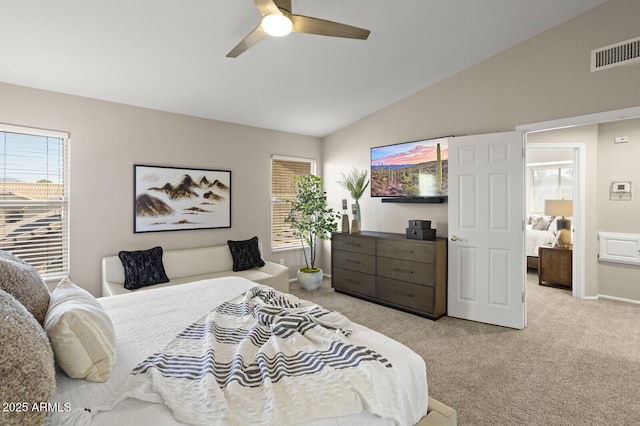 carpeted bedroom featuring vaulted ceiling and ceiling fan