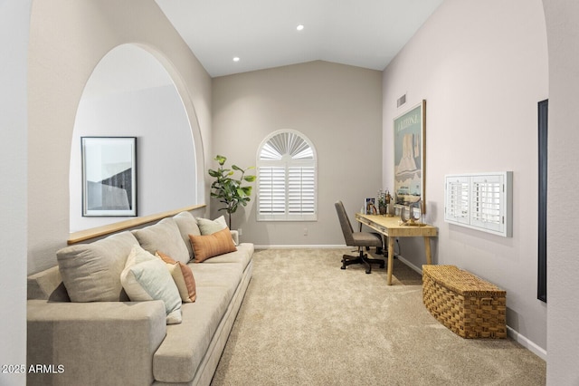 office with vaulted ceiling and carpet flooring