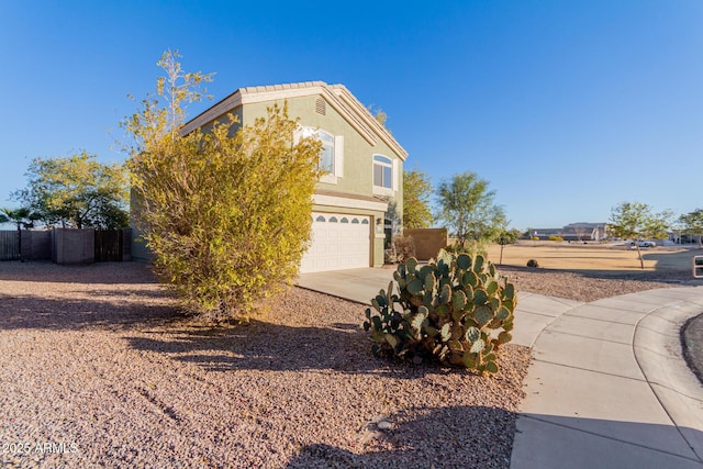 view of side of home with a garage