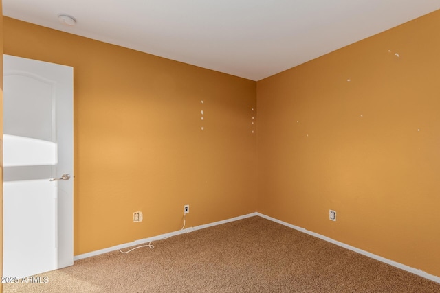 unfurnished room with carpet floors