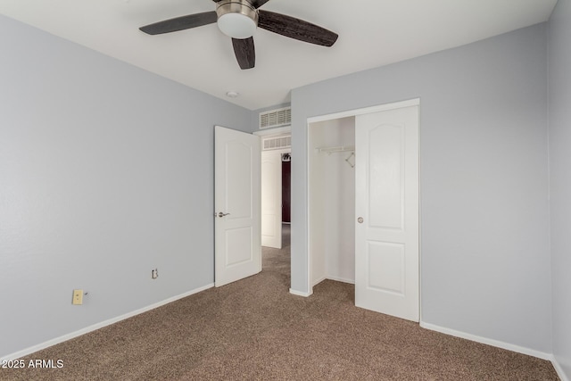 unfurnished bedroom featuring a closet, ceiling fan, and carpet