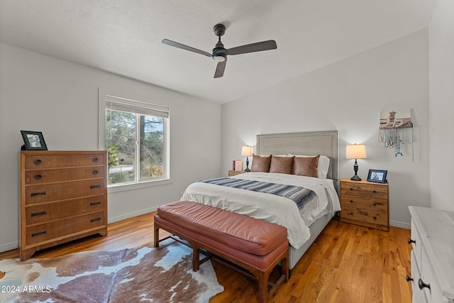 bedroom with light wood-type flooring and ceiling fan