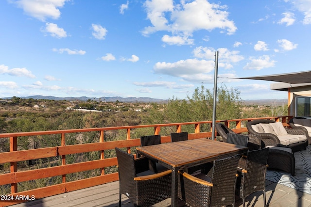 wooden deck featuring a mountain view