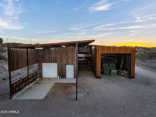 view of outdoor structure at dusk