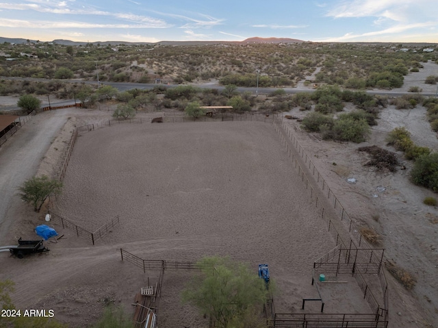 birds eye view of property with a mountain view