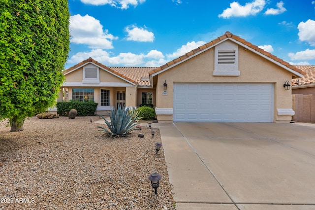 16230 E Glenpoint Dr, Fountain Hills, AZ 85268 - view of front of house with concrete driveway, stucco siding, a tiled roof, and a garage