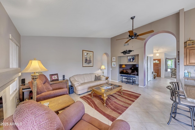 16230 E Glenpoint Dr, Fountain Hills, AZ 85268 - living room with visible vents, lofted ceiling, ceiling fan, arched walkways, and light tile patterned flooring