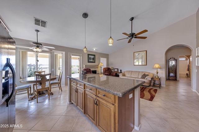 16230 E Glenpoint Dr, Fountain Hills, AZ 85268 - kitchen with arched walkways, visible vents, light tile patterned floors, and ceiling fan