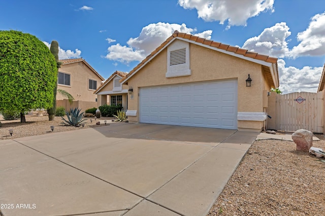 16230 E Glenpoint Dr, Fountain Hills, AZ 85268 - view of front of home featuring a gate, a garage, stucco siding, fence, and driveway