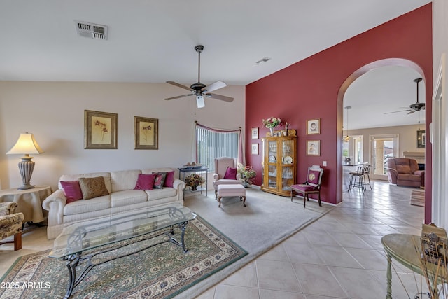 16230 E Glenpoint Dr, Fountain Hills, AZ 85268 - living room featuring light tile patterned floors, visible vents, a ceiling fan, and arched walkways