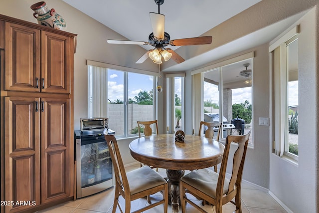 16230 E Glenpoint Dr, Fountain Hills, AZ 85268 - dining space with light tile patterned floors, baseboards, ceiling fan, and beverage cooler