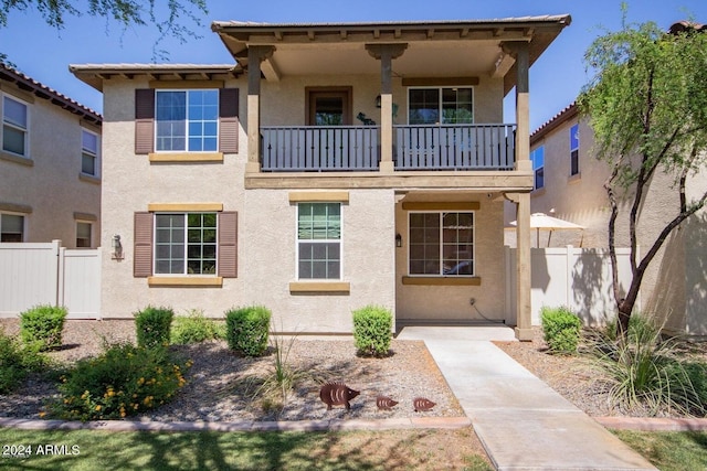 view of front of property with a balcony