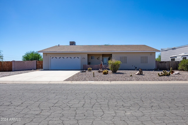 ranch-style home featuring a garage