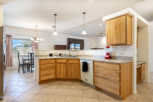 kitchen featuring ceiling fan with notable chandelier, kitchen peninsula, sink, and white dishwasher