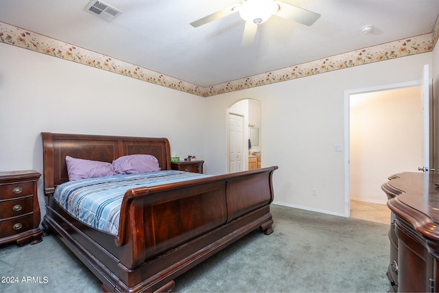 bedroom with ceiling fan and light colored carpet