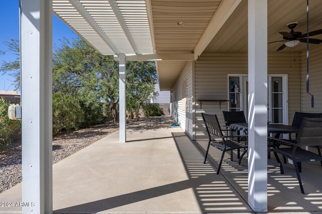 view of patio featuring ceiling fan