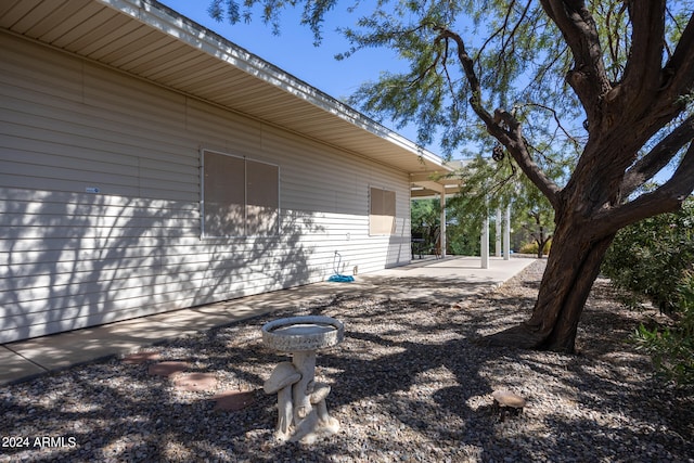 view of property exterior featuring a patio