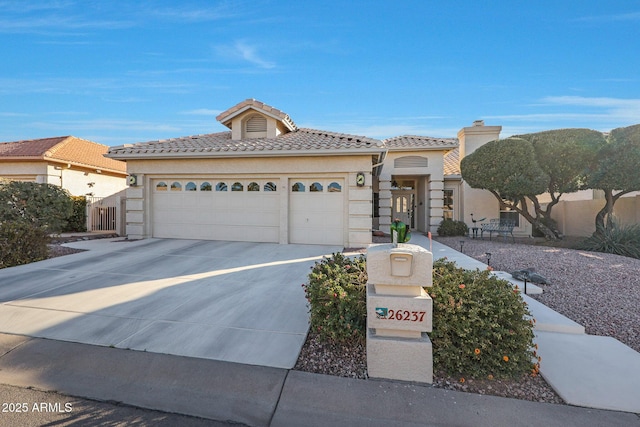 mediterranean / spanish house featuring a garage