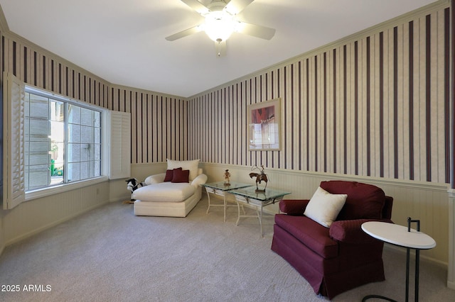 sitting room featuring ceiling fan and light colored carpet