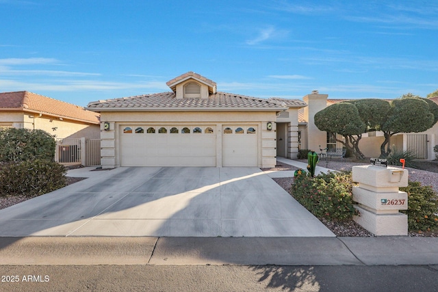 mediterranean / spanish house featuring a garage