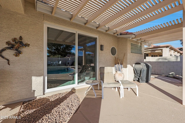 view of patio / terrace with a pergola and a grill