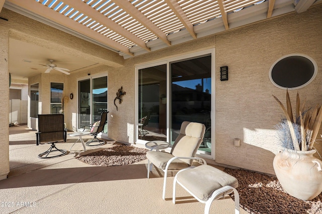 view of patio featuring a pergola and ceiling fan