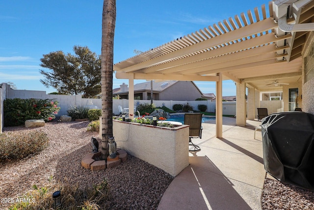 view of patio featuring a fenced in pool, grilling area, a pergola, and ceiling fan