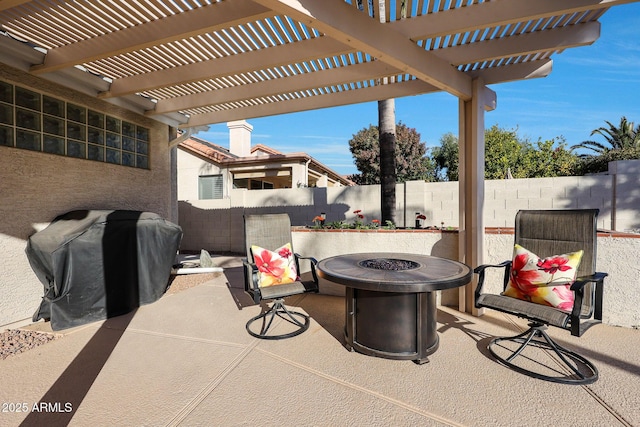 view of patio / terrace with a pergola, a fire pit, and a grill