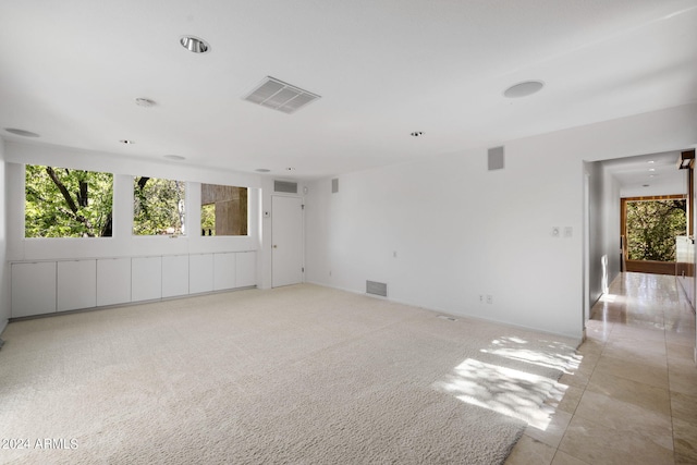 empty room with light colored carpet