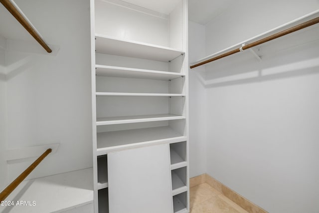 walk in closet featuring light tile patterned floors