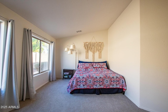 carpeted bedroom featuring vaulted ceiling