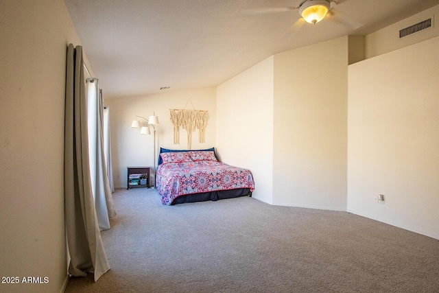 bedroom with lofted ceiling, carpet floors, and ceiling fan