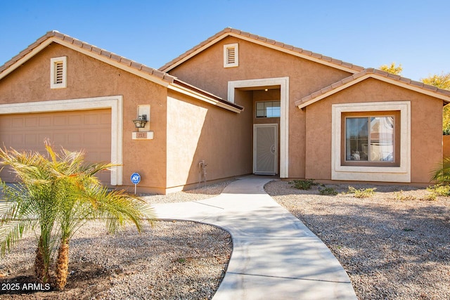 view of front of property with a garage